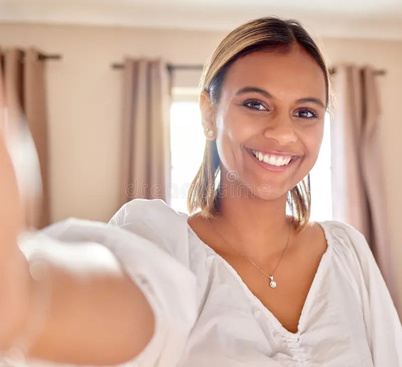 files/woman-portrait-smile-selfie-profile-picture-vlog-social-media-post-home-happy-friendly-beauty-female-woman-portrait-270334002.webp